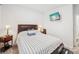 Comfortable bedroom with carpeted floors, a decorative headboard, and an ambient lamp at 9525 Festival Way, Charlotte, NC 28215