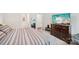 Spacious bedroom showcasing a dresser and a large TV at 9525 Festival Way, Charlotte, NC 28215