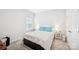 Bright bedroom with a queen bed, white walls, and a window at 9525 Festival Way, Charlotte, NC 28215