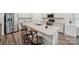 Bright kitchen featuring an island with seating, modern appliances, and stylish countertops at 9525 Festival Way, Charlotte, NC 28215