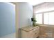 Bright bathroom vanity featuring granite countertop and decorative plant at 9901 Pallisers Ter, Charlotte, NC 28210