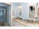 Dual sink bathroom with granite countertops and walk-in shower at 9901 Pallisers Ter, Charlotte, NC 28210