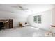 Bright bonus room with a comfortable futon, and neutral carpeting at 9901 Pallisers Ter, Charlotte, NC 28210