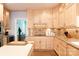 Well-appointed kitchen with light wood cabinets, tile backsplash, and modern appliances at 9901 Pallisers Ter, Charlotte, NC 28210