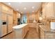 Spacious kitchen with a center island, stainless steel appliances, and ample cabinet space at 9901 Pallisers Ter, Charlotte, NC 28210