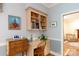 Bright office space with custom shelving and built-in desk, perfect for working from home at 9901 Pallisers Ter, Charlotte, NC 28210