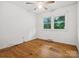 Bright bedroom features a ceiling fan and natural light from two windows at 1008 Midway Dr, Gastonia, NC 28054