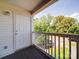 Balcony with wood floor and white rails overlooks the parking lot at 1023 Triece Ln, Charlotte, NC 28215