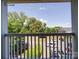 Balcony overlooking parking lot and lush green landscape at 1023 Triece Ln, Charlotte, NC 28215