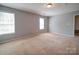 Bright bedroom with dual windows offering great natural light and views at 1023 Triece Ln, Charlotte, NC 28215