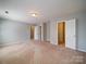 Open bedroom with multiple closets and doors, providing ample space and accessibility at 1023 Triece Ln, Charlotte, NC 28215