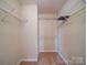 Walk-in closet with built-in shelving, maximizing storage space for organization at 1023 Triece Ln, Charlotte, NC 28215