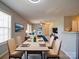 Well-lit dining room flowing into the living room, with modern decor and open layout at 1023 Triece Ln, Charlotte, NC 28215