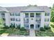 Three-story condo building shows off its symmetrical facade, balconies, and well-kept landscaping at 1023 Triece Ln, Charlotte, NC 28215