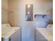 Bright laundry area featuring shelving for storage and easy access to utilities at 1023 Triece Ln, Charlotte, NC 28215