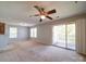 Spacious living room showing natural light and a patio door with view, open to the kitchen at 1023 Triece Ln, Charlotte, NC 28215