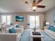 Bright living room features a ceiling fan, plush rug and access to outdoor balcony with natural light at 1023 Triece Ln, Charlotte, NC 28215