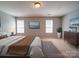 Bright main bedroom with a large bed, and stylish modern decor at 1023 Triece Ln, Charlotte, NC 28215