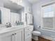 Bright bathroom features a white vanity, framed mirror, and a window for natural light at 1067 33Rd Avenue Ne Loop, Hickory, NC 28601