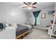 Cozy bedroom with natural light, a ceiling fan, and a comfortable bed at 1067 33Rd Avenue Ne Loop, Hickory, NC 28601