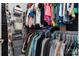 Organized walk-in closet with hanging racks and shelving for optimal storage at 1067 33Rd Avenue Ne Loop, Hickory, NC 28601