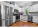Modern kitchen with stainless steel appliances, white cabinetry, and hardwood floors at 1067 33Rd Avenue Ne Loop, Hickory, NC 28601