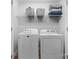 Convenient laundry area with washer, dryer, and shelving for organized storage at 1067 33Rd Avenue Ne Loop, Hickory, NC 28601