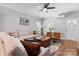 Bright and spacious living room with a large sectional sofa, hardwood floors, and ample natural light at 1067 33Rd Avenue Ne Loop, Hickory, NC 28601