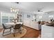 Open-concept living space with a dining area, comfortable sofa, and natural light, perfect for entertaining at 1067 33Rd Avenue Ne Loop, Hickory, NC 28601