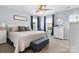 Inviting main bedroom features a king bed, ceiling fan, and natural light from windows at 1067 33Rd Avenue Ne Loop, Hickory, NC 28601