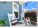 Inviting front porch with rocking chairs, creating a relaxing outdoor space to enjoy the neighborhood views at 1067 33Rd Avenue Ne Loop, Hickory, NC 28601