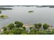 A stunning aerial view of lakefront homes, lush greenery, and serene waters on a clear day at 123 Sailview Rd, Mooresville, NC 28117
