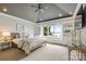 Bright bedroom featuring a scenic lake view, custom built-ins, and a ceiling fan at 123 Sailview Rd, Mooresville, NC 28117