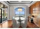 Breakfast nook with glass table offers views of the lake from expansive windows at 123 Sailview Rd, Mooresville, NC 28117