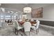 Stylish dining room featuring a round table, comfortable seating, and lake views at 123 Sailview Rd, Mooresville, NC 28117