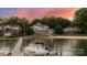 Stunning waterfront home with private dock, sandy beach, and mature trees under a colorful sky at 123 Sailview Rd, Mooresville, NC 28117