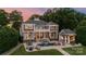 Grand estate boasts a private pool, waterside slide, covered gazebo with outdoor kitchen, and manicured lawn at 123 Sailview Rd, Mooresville, NC 28117