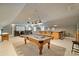 Entertain in style with this home's expansive game room featuring a pool table and bar at 123 Sailview Rd, Mooresville, NC 28117