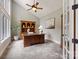 Cozy home office with a large desk, built-in bookcase, and ample natural light at 123 Sailview Rd, Mooresville, NC 28117
