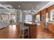 Kitchen with center island, wood cabinets, stainless appliances, and views of lake at 123 Sailview Rd, Mooresville, NC 28117