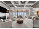 Spacious living room features coffered ceilings, a fireplace, and panoramic views of the lake at 123 Sailview Rd, Mooresville, NC 28117