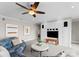 Beautifully decorated living room with a cozy couch, an entertainment center and contemporary wall art at 123 Sailview Rd, Mooresville, NC 28117