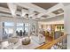 Open-concept living area with coffered ceilings flows into a modern kitchen and offers lake views at 123 Sailview Rd, Mooresville, NC 28117