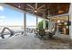 Covered patio with stone floor and pillars, plus an outdoor seating area and waterfront views at 123 Sailview Rd, Mooresville, NC 28117