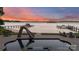 Lakeside pool with a waterslide, offering direct access to the water and sunset views at 123 Sailview Rd, Mooresville, NC 28117