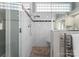 Modern shower featuring updated shower head, bench, and glass enclosure at 123 Sailview Rd, Mooresville, NC 28117