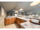The wet bar features a sink, tile countertops, wooden cabinetry and pendant lighting at 123 Sailview Rd, Mooresville, NC 28117