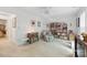 Bedroom featuring white walls, carpet, a floral armchair, and multiple bookshelves at 12350 Swan Wings Pl, Huntersville, NC 28078