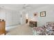 Bedroom with white walls, carpet, ceiling fan, and floral armchair at 12350 Swan Wings Pl, Huntersville, NC 28078