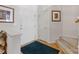 Welcoming entryway with white doors, light walls, hardwood flooring, and carpeted stairs at 12350 Swan Wings Pl, Huntersville, NC 28078